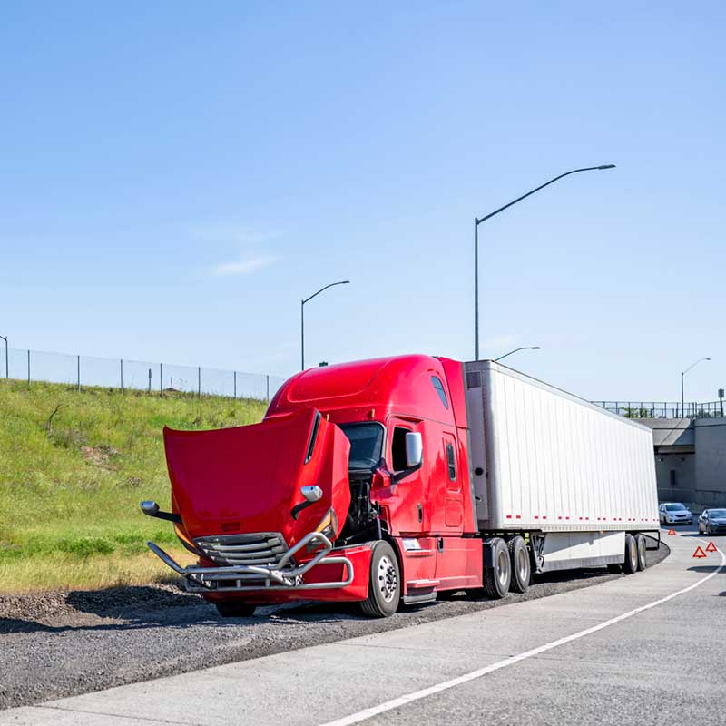 Red broken big rig semi truck